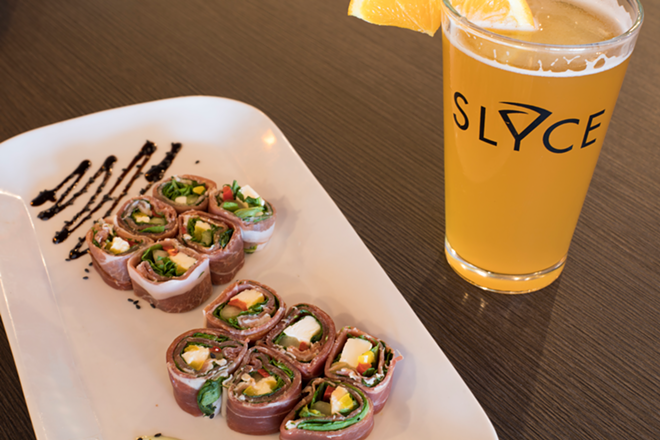 Slyce's Italian sushi roll wraps prosciutto around arugula, cucumber, roasted peppers and mozzarella. - Nicole Abbett