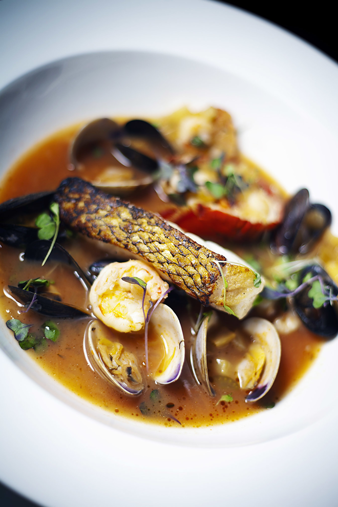 TASTE OF MARSEILLE: A flavorful bouillabaisse with Chilean sea bass, mussels, clams and shrimp. - SHANNA GILLETTE