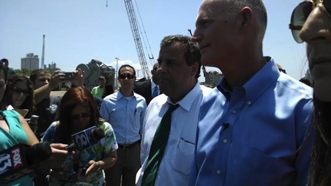 Chris Christie & Rick Scott pressed the flesh along the way to a campaign speech where they blasted Charlie Crist - Mitch Perry