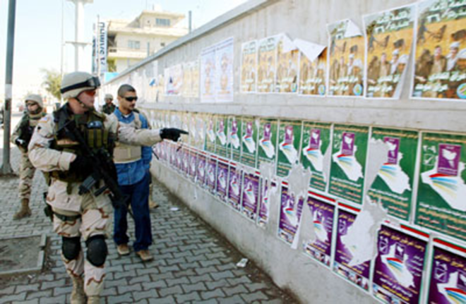 Capt. Scarcliff at a wall of election posters in My Country, My Country. - Josh Williams