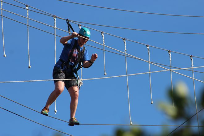 Empower Adventures crossing obstacle ropes - Steph Waechter