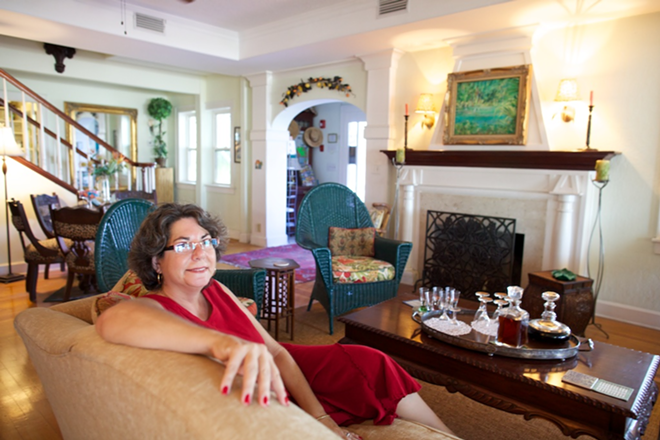 A rare moment of relaxation for busy innkeeper and Gulfport booster Lori Rosso. - David Warner