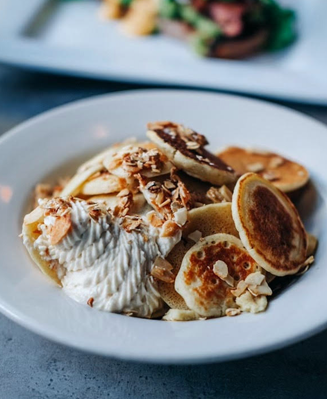 Mini Pancake Cereal ($12): Mini pancakes, peanut butter whipped cream, maple syrup and almond granola. - COURTESY