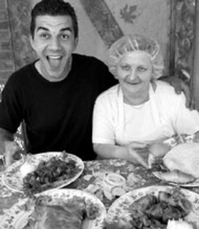 SMILE IF YOU LOVE BOSNIAN FOOD: Family - European Garden Cafe owners Edin Fekovic and - Faika Jagnic are happy about the spinach cheese - pies, shish chevapi, stuffed cabbage rolls and round - bread they've just prepared. - Sean Deren