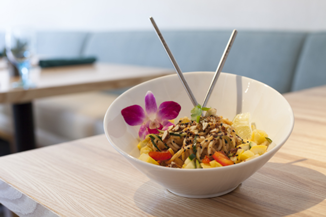 The café's BOTB-winning pad Thai, garnished with a Dendrobium orchid. - Nicole Abbett