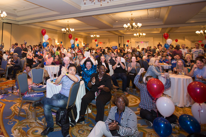 At Tampa's Marriott Waterside Hotel, anxious Democrats watch as returns come in. - Chip Weiner