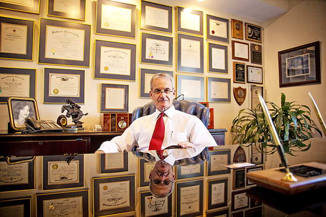 PICKING HIS BATTLES: Friends say he’s mellowed, but Fernandez (photographed in his Tampa law office) is always ready to rumble when it comes to arguing Cuba policy. - Shanna Gillette