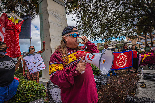 Sheridan Murphy protests Tampa’s Christopher Columbus statue on Oct. 11, 2020. - Dave Decker