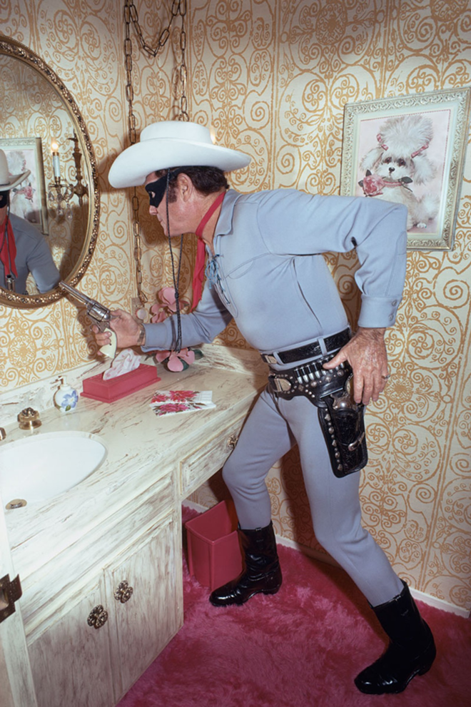 TREASURED SNAPSHOT: Lee’s portrait of The Lone Ranger, Clayton Moore, at home in 1971, hangs in Waddell's home now. - BUD LEE