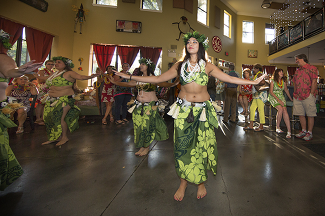 Yen Watanabe, the newest member of the Hula dance troupe Hip Expressions, performs for the luau. - Chip Weiner