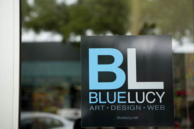 The distinctive logo of Bluelucy on the window of their new digs on the 600 Block. - Chip Weiner Photographic Arts
