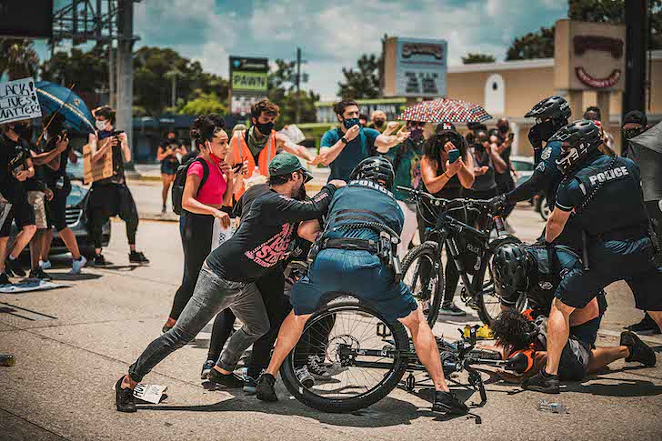 TPD beating protesters blocking traffic on Dale Mabry last July. - Photo by Chandler Culotta