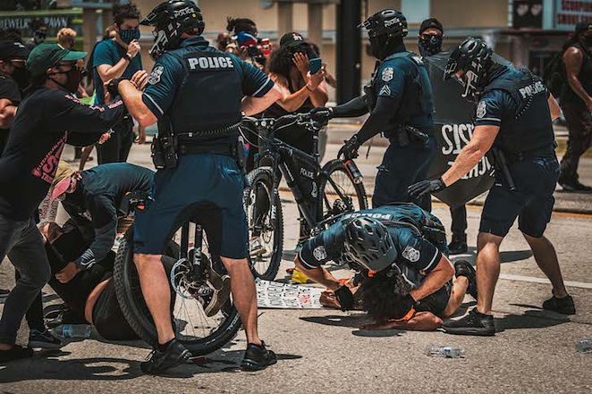 TPD tackling protesters on July 4, 2020. - Photo by Chandler Culotta