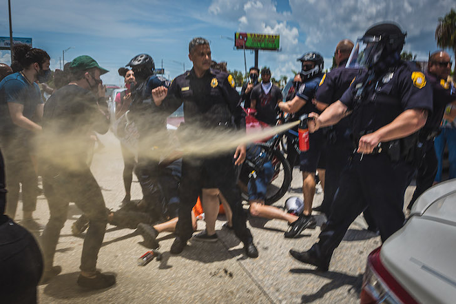 TPD clashing with protesters on July 4, 2020, after they blocked traffic on Dale Mabry Highway. - Photo by Dave Decker
