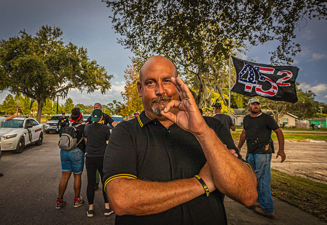 A Proud Boy flashes the 'white power' sign in New Port Richey, Florida on November 8, 2020. - Dave Decker