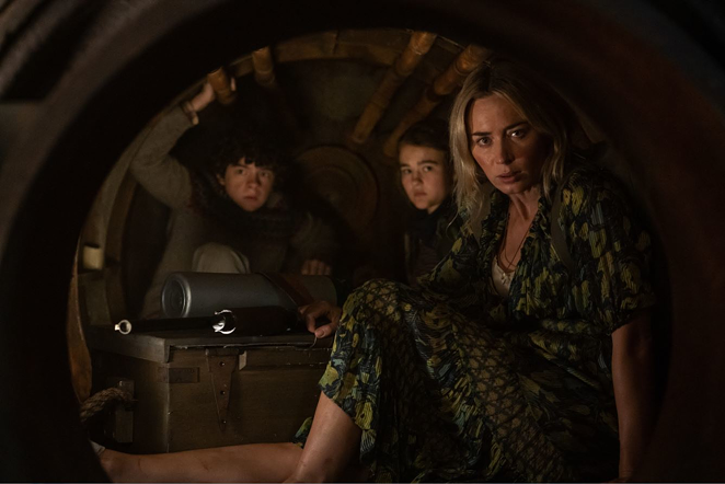 Evelyn (Emily Blunt, far right) and her children, from left, Marcus and Regan, hide inside a furnace to avoid alien attackers in "A Quiet Place Part II" - Paramount Pictures