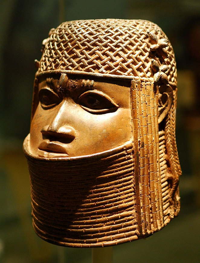 Ancestral head of an oba (a king), part of an exhibition on empire and museum collections, and an example of Benin bronze sculpture. - Matt Neale from UK, CC BY-SA 2.0 , via Wikimedia Commons