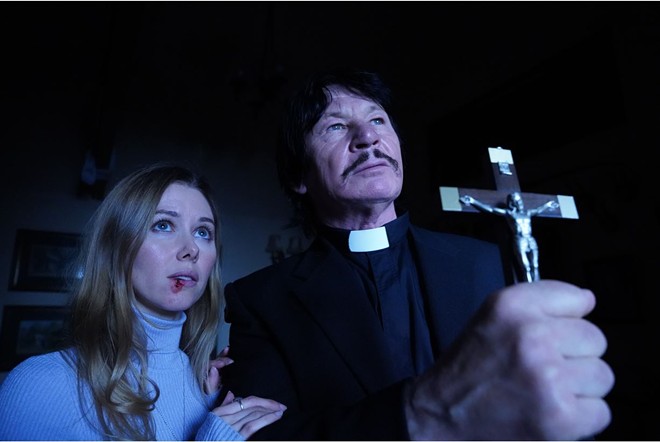 Do not adjust your eyes, that's Robert Bronzi (right), not Charles Bronson, in this terrible exorcism flick. - Photo via Uncork'd Entertainment