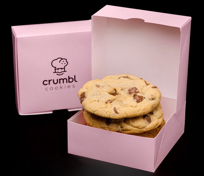 Milk chocolate chip cookies in Crumbl's iconic pink boxes. - Crumbl Cookies / Facebook