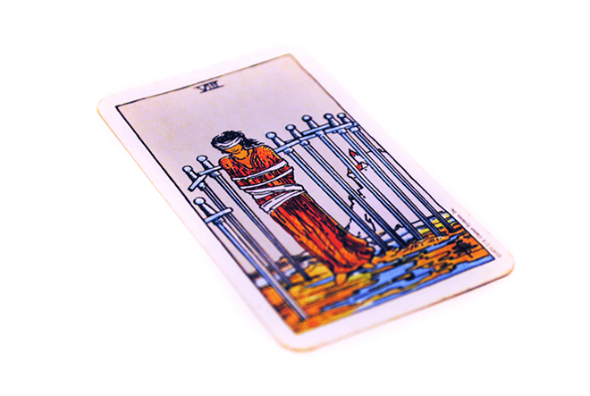The Eight of Swords is a card for feeling depressed and trapped, seemingly without a way out. - PHOTO VIA ADOBE