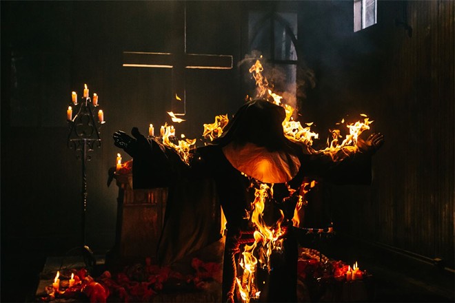 There isn't a whole lot that happens in 'They Talk,' but this fully engulfed nun appears during the best parts of the movie. - PHOTO VIA UNCORK'D ENTERTAINMENT