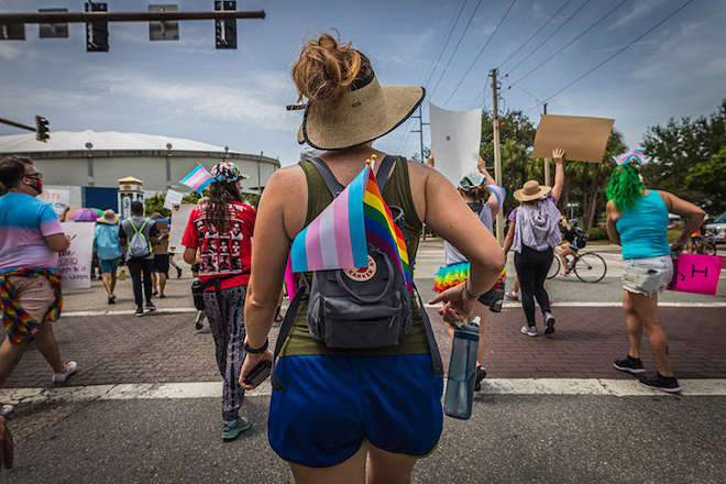 A protester marches with the trans and pride flag in St. Petersburg, Florida on June 28, 2020. - Dave Decker