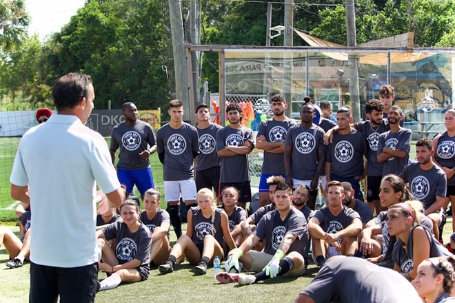 Strikers head coach Martín Gramática speaks to the crowd of players that showed up to tryouts. - Max Steele