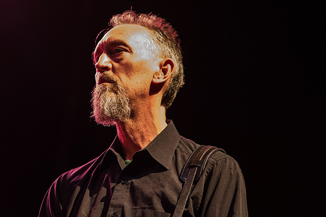Norman Westberg performing with with Swans in Boston, Massachusetts in 2014. - Tim Bugbee (tinnitus photography) and digboston, CC BY 2.0