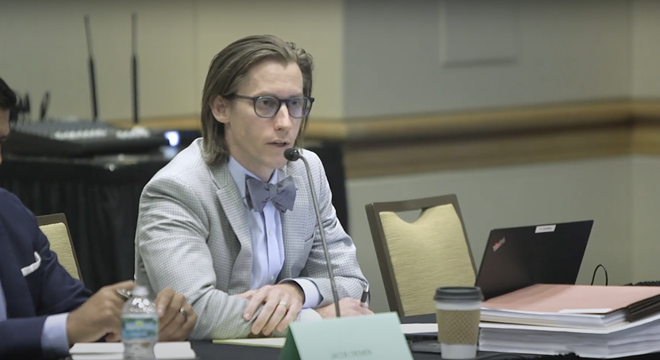Lawyer Jacob Cremer explains the reasoning behind developer Punit Shah's litigation against the City of Tampa at a meeting. - Via YouTube/LunarVueMedia