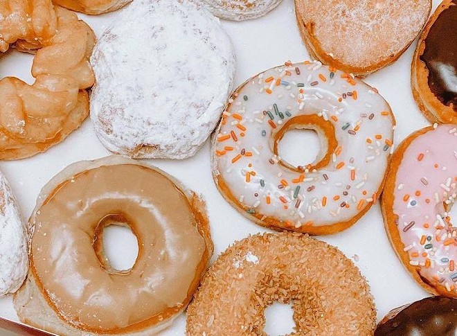 Tampa Bay Dunkin' and Krispy Kreme stores are slinging free doughnuts on Friday