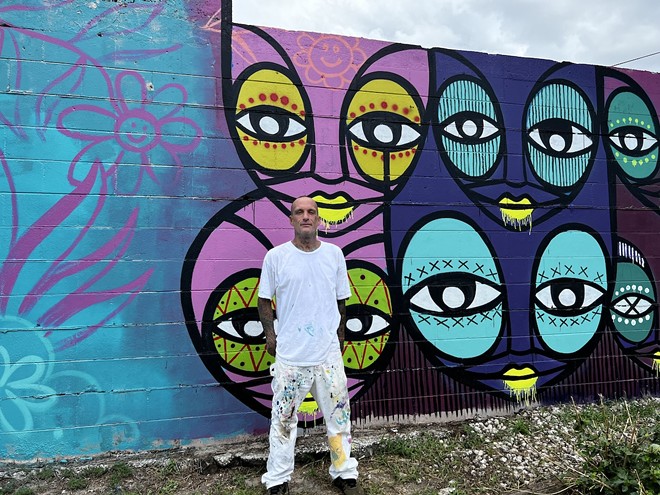 Kris Markovich paints at Tampa Mural School. - Photo bby Jennifer Ring