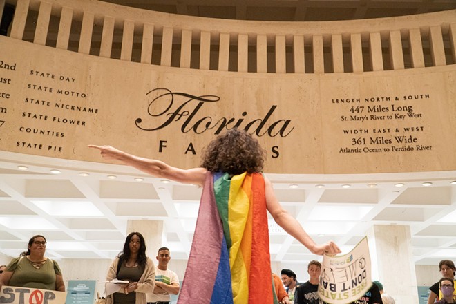 Will Larkins, an 18-year-old Winter Park High School senior, points to the House Chamber, criticizing bills that target transgender rights during the transgender visibility day rally at Florida’s Capitol in Tallahassee, Fla, on Mar. 31, 2023. - Photo by Mickenzie Hannon/Fresh Take Florida
