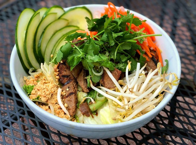 Zen's grilled noodle bowl with vermicelli noodles, cucumber, cilantro, grilled pork and shredded lettuce. - zennoodlebargainesville/Facebook