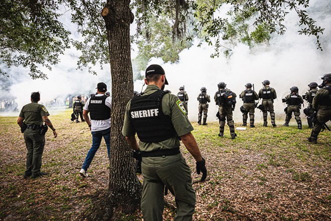Tear gas being fired into crowd at USF pro-Palestine rally in late April, 2024. - Photo by Dave Decker
