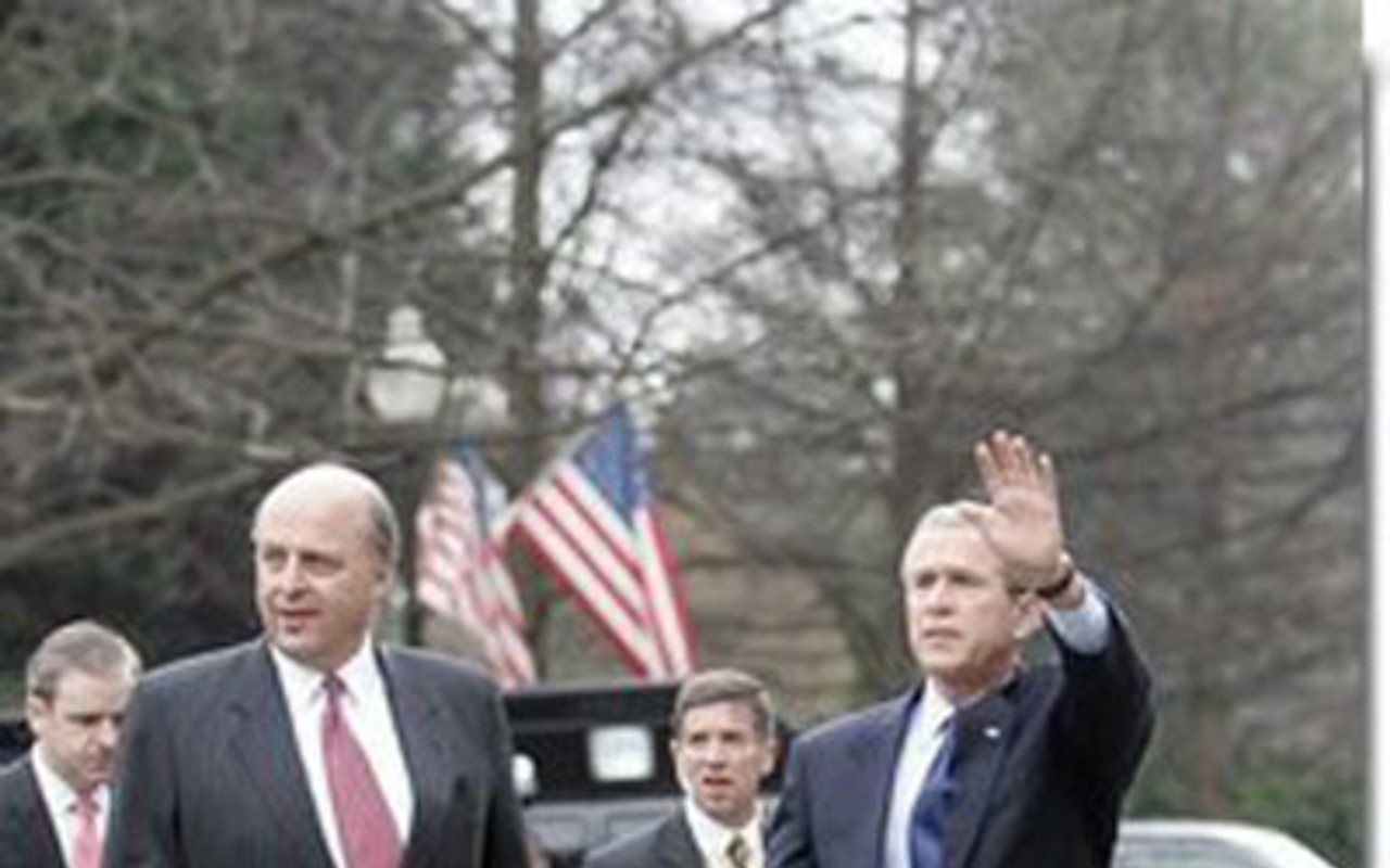 Director of National Intelligence John Negroponte and President George W. Bush in February 2005. Negroponte's job includes bringing to life a national domestic spying network the Bush administration calls the "Information Sharing Environment."