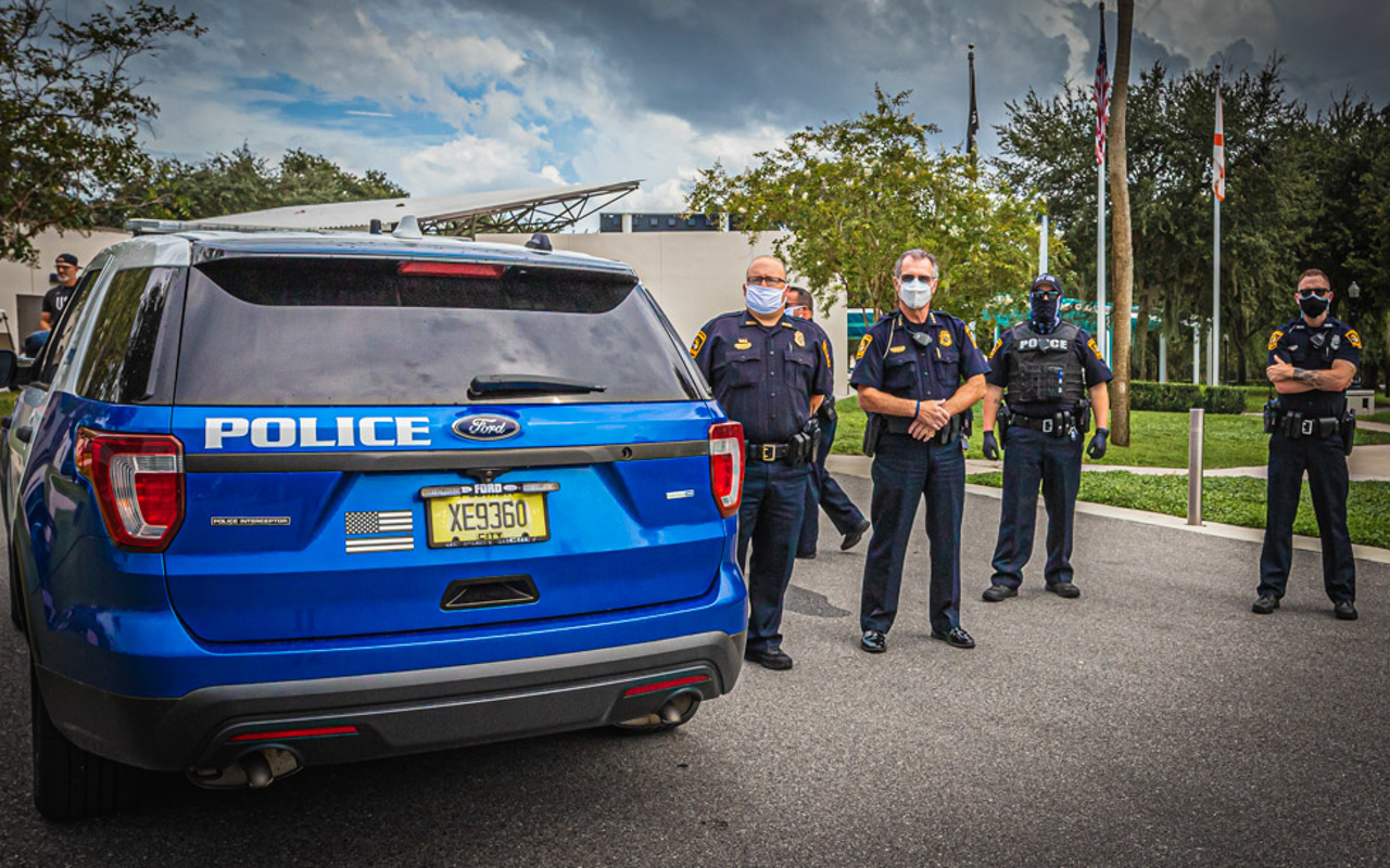 Police officers stand by during a protest in New Port Richey, Florida on Aug. 23, 2020.