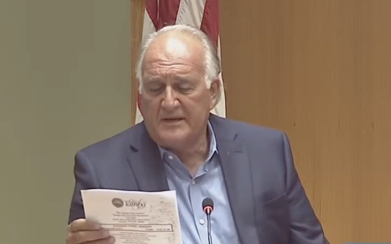 John Dingfelder reads a City of Tampa document during a city council meeting in March.