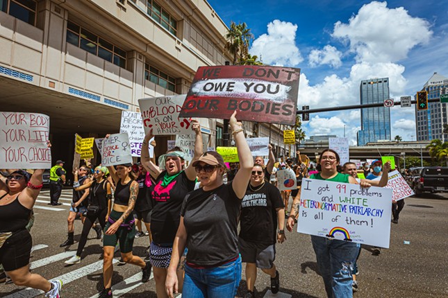 Protestors marched from Gaslight Square Park to the Water Street Marriott in Tampa, Florida.
