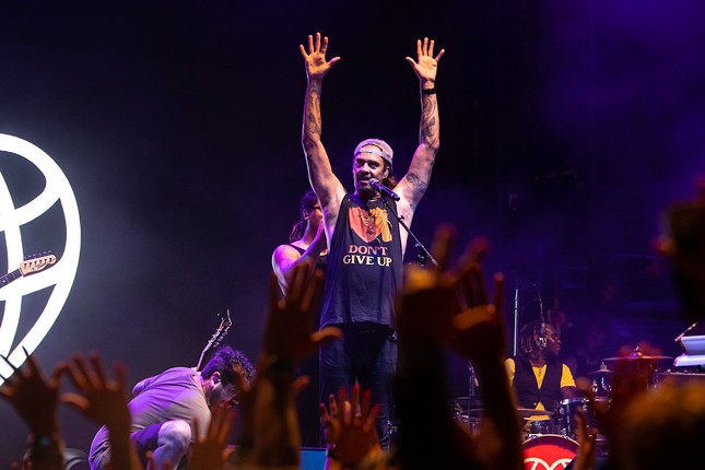 Photos of Michael Franti and Of Good Nature playing a very-sold out St. Pete concert at Jannus Live