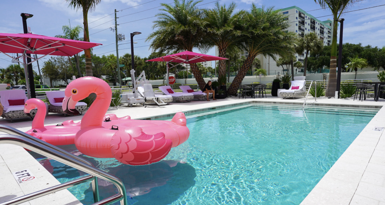 The Saint Hotel
7201 Sunset Way, St. Pete Beach, 727-360-0120    
$50-$200
With it’s hot pink umbrellas, flamingo floaties and retro allure, you can’t miss The Saint Hotel. Day passes for a reserved lounge chair, games (such as cornhole, Connect Four, and giant Jenga), and access to the hotel’s pool and hot tub from dusk to dawn are $50. For $200, guests can upgrade to a shaded daybed. Parking and Wi-Fi are included in the cost of passes. And while you’re there, head to the neighboring 82 Degrees for an indulgent dinner after a day in the sun. 
Photo via thesainthotel.com