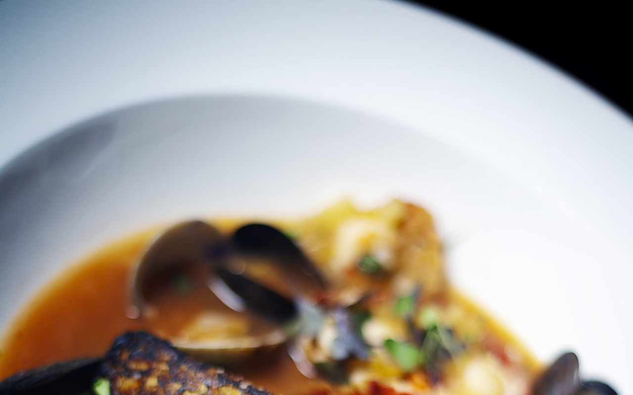 TASTE OF MARSEILLE: A flavorful bouillabaisse with Chilean sea bass, mussels, clams and shrimp.