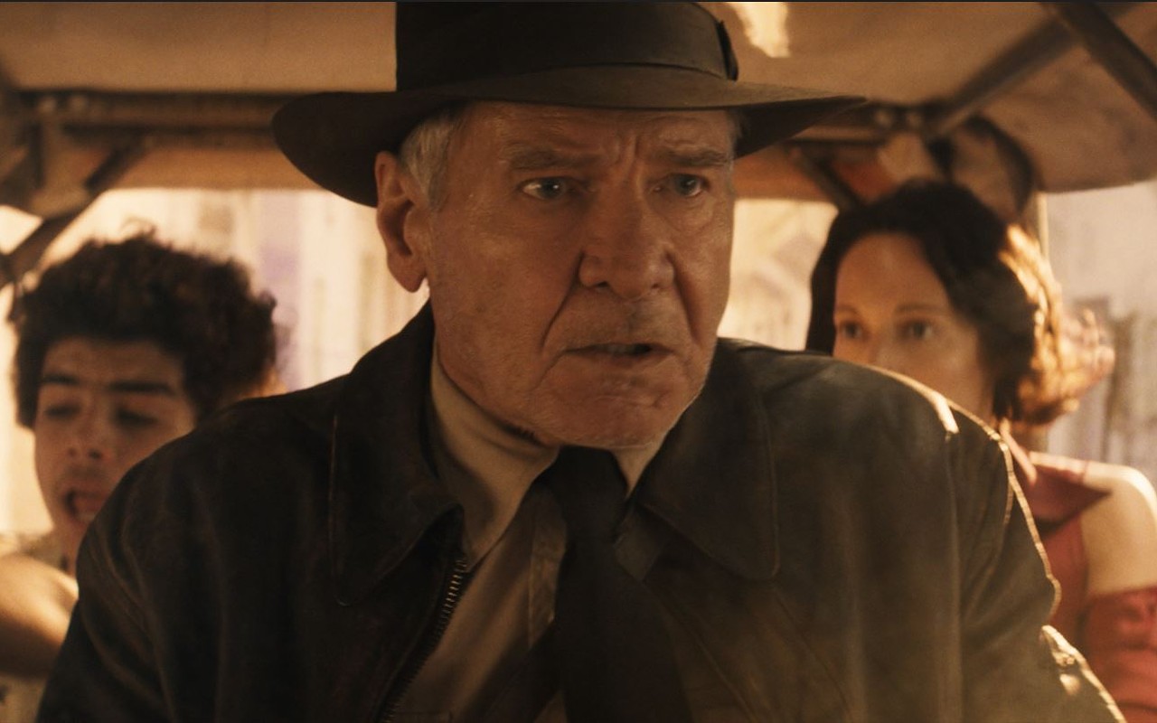 Indiana Jones (Harrison Ford) wakes up from a nap to revisit the past and replace key characters from his old adventures with new faces like Teddy (Ethann Isidore), left, and Helena (Phoebe Waller-Bridge).