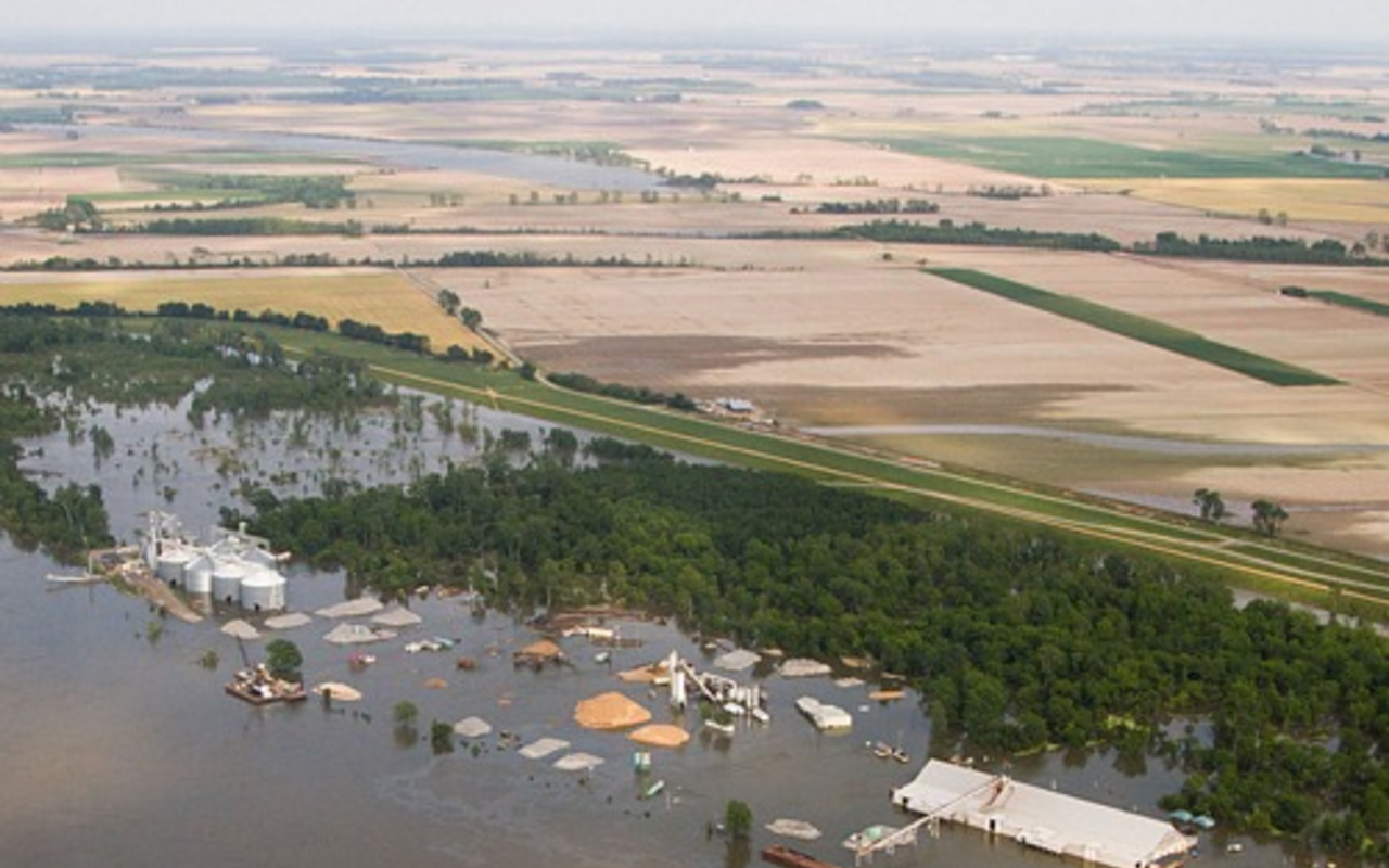 An aerial view of farms flooded alongside the Mississippi River.
